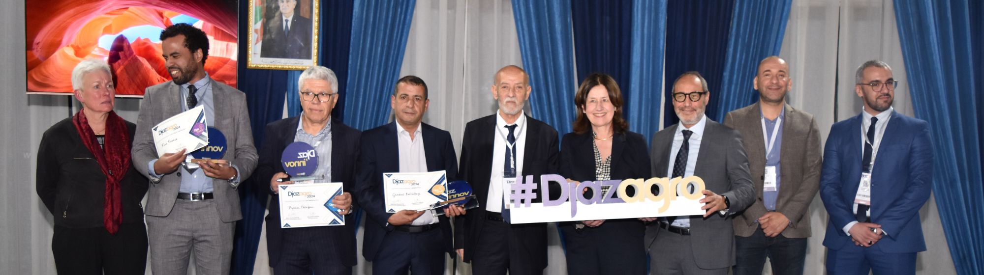 DjazInnov Banner awards ceremony at Djazagro 2024. Group of winners and organizers holding trophies and certificates
