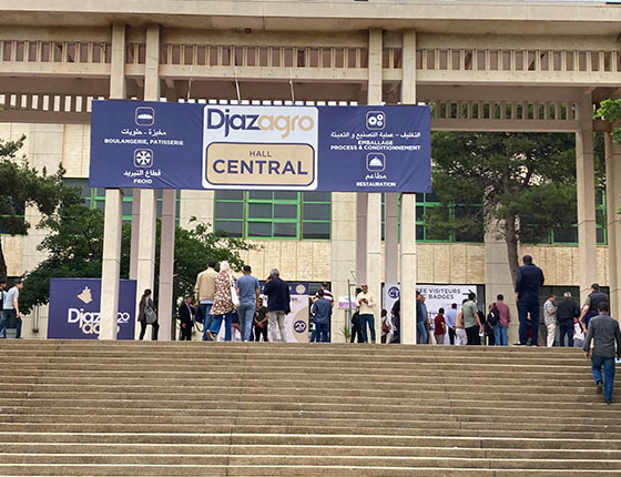 People in front of the entrance to the show in Algeria