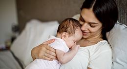 Mother holding her baby