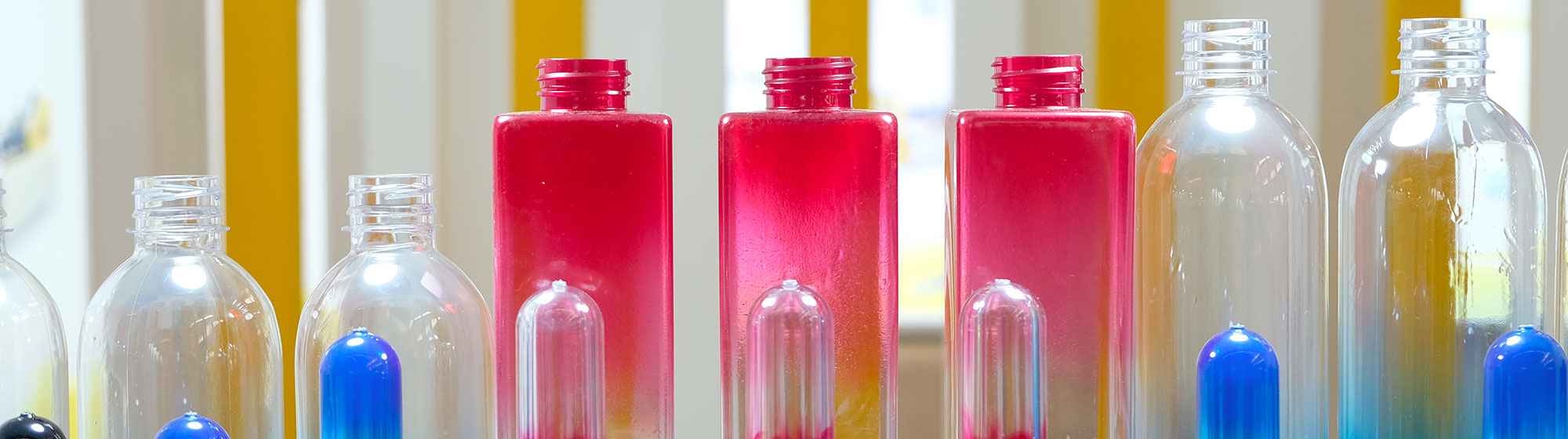 A shelf displaying a variety of colorful bottles.