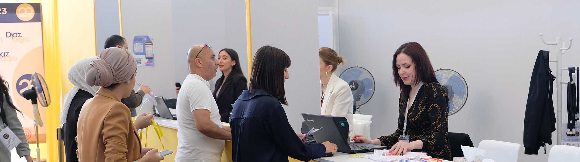 Hostess directing visitors at the reception desk